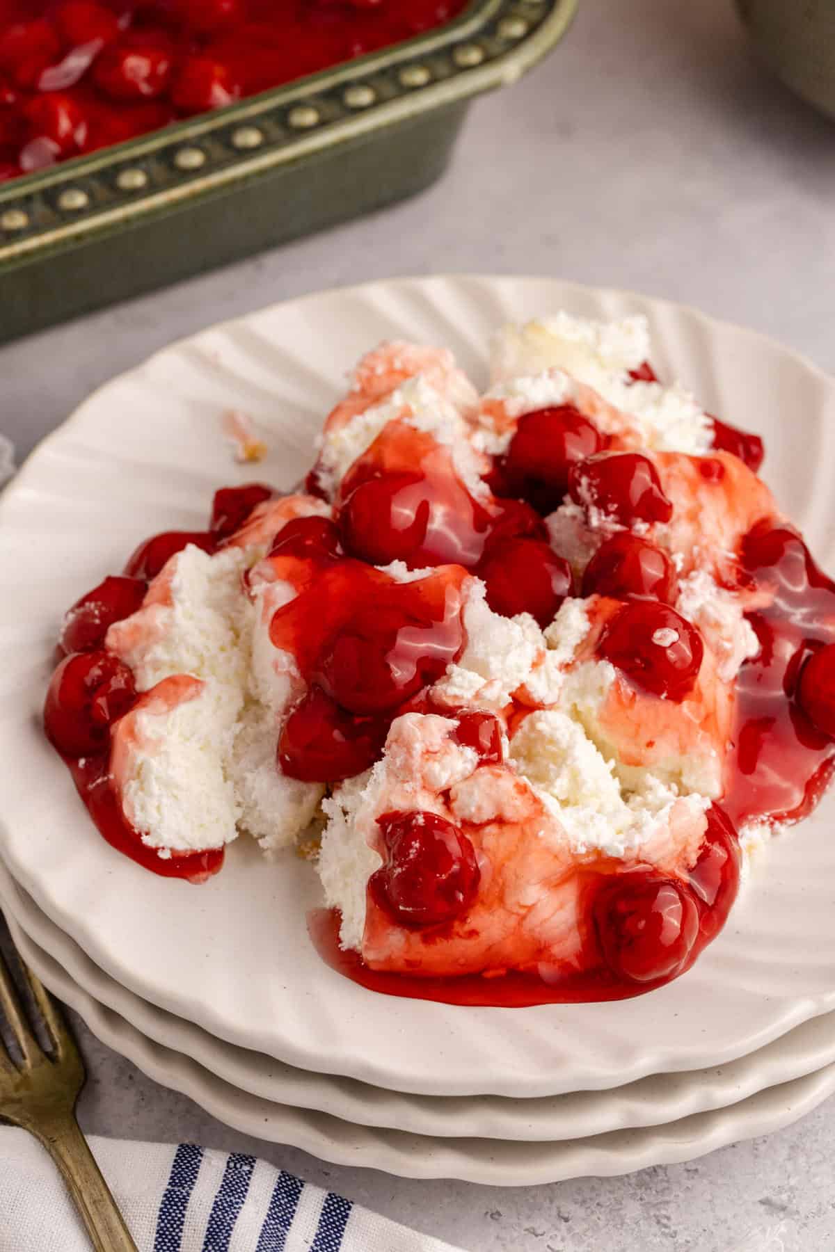 Cherries in the Snow on a plate with a casserole in the back
