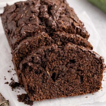 Chocolate Zucchini Loaf with slices laying up against it