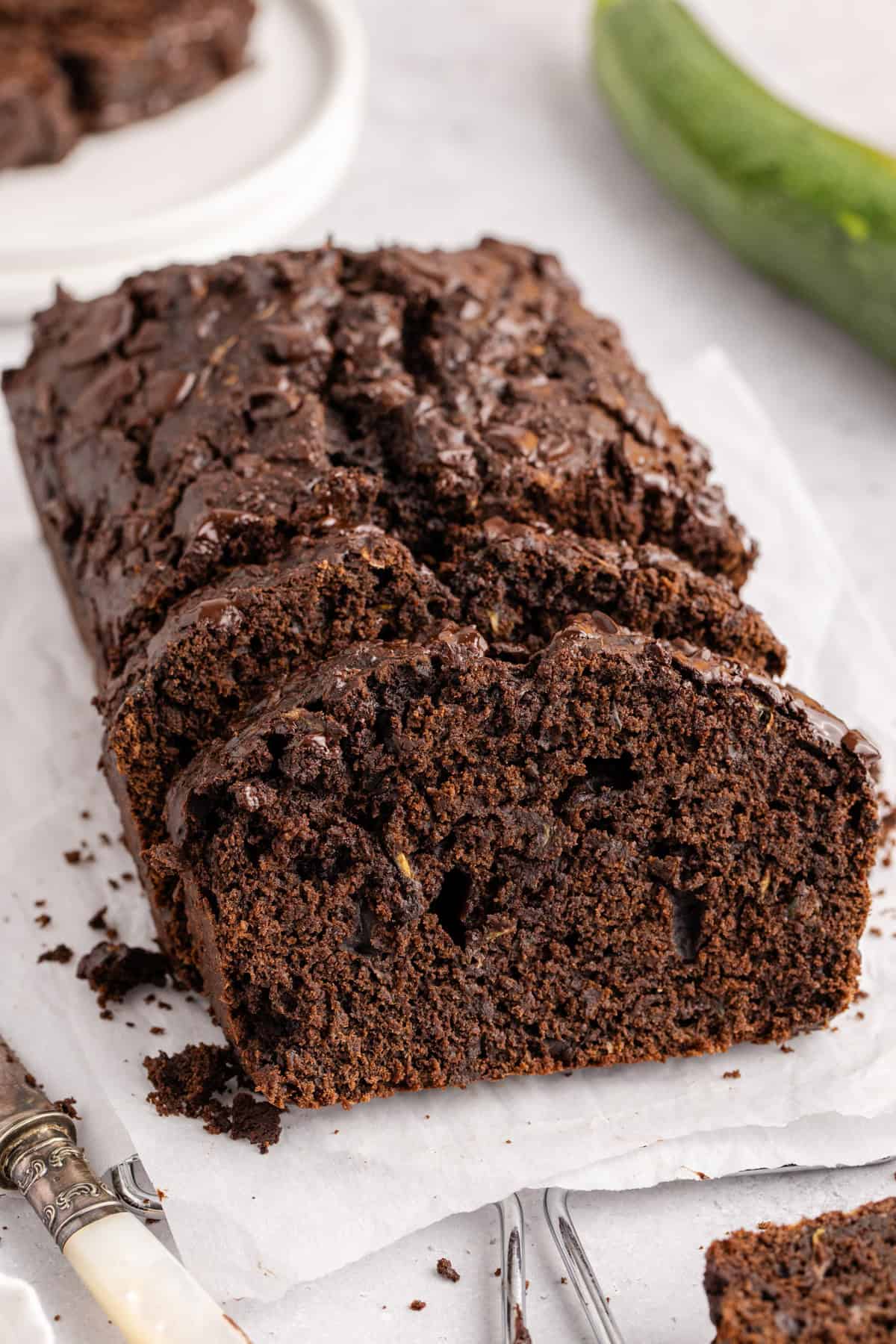 Chocolate Zucchini Loaf with slices laying up against it