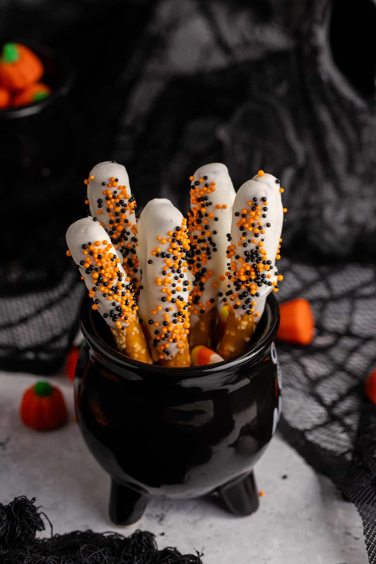 Halloween Pretzel Rods in a cauldron