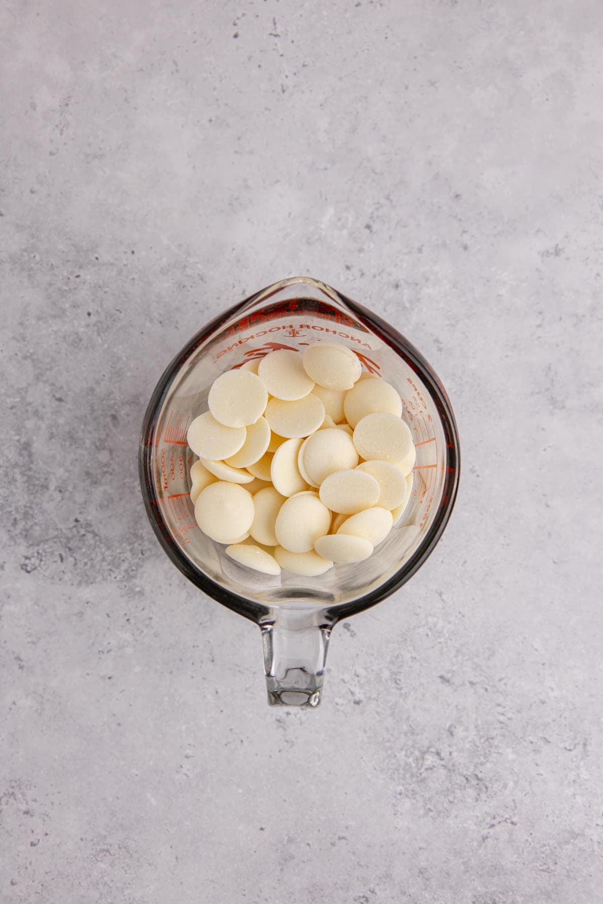 White chocolate melts in a glass measuring cup