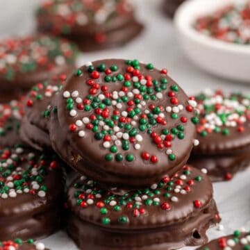 Ritz Cracker Christmas Cookies with red, white and green sprinkles stacked