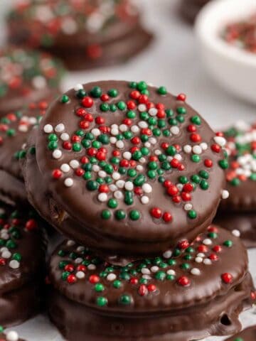 Ritz Cracker Christmas Cookies with red, white and green sprinkles stacked
