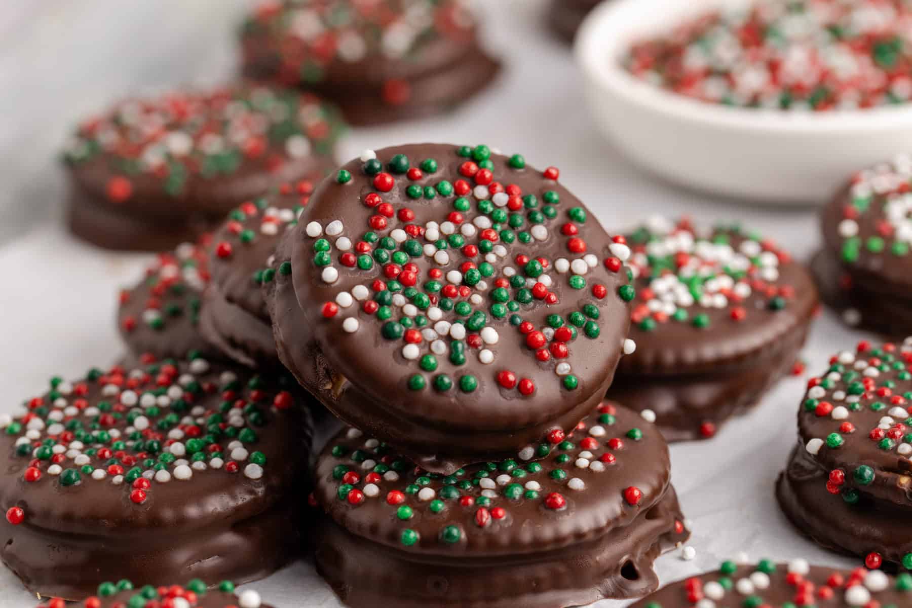 Ritz Cracker Christmas Cookies with red, white and green sprinkles stacked