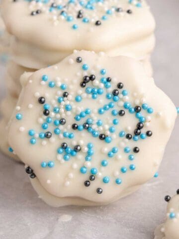 White Chocolate Ritz Cracker Cookies with a cookie leaning against a stack