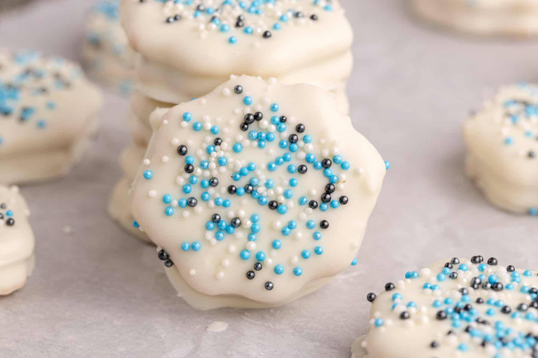 White Chocolate Ritz Cracker Cookies with a cookie leaning against a stack