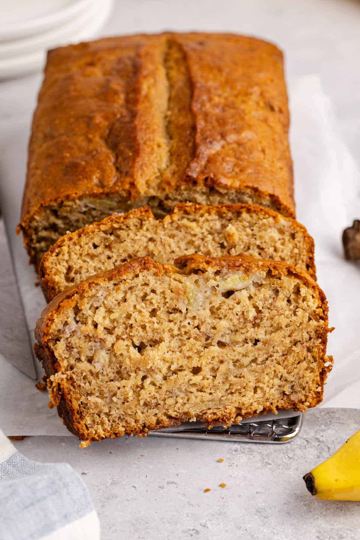 Banana Bread slices cleaning up against the loaf