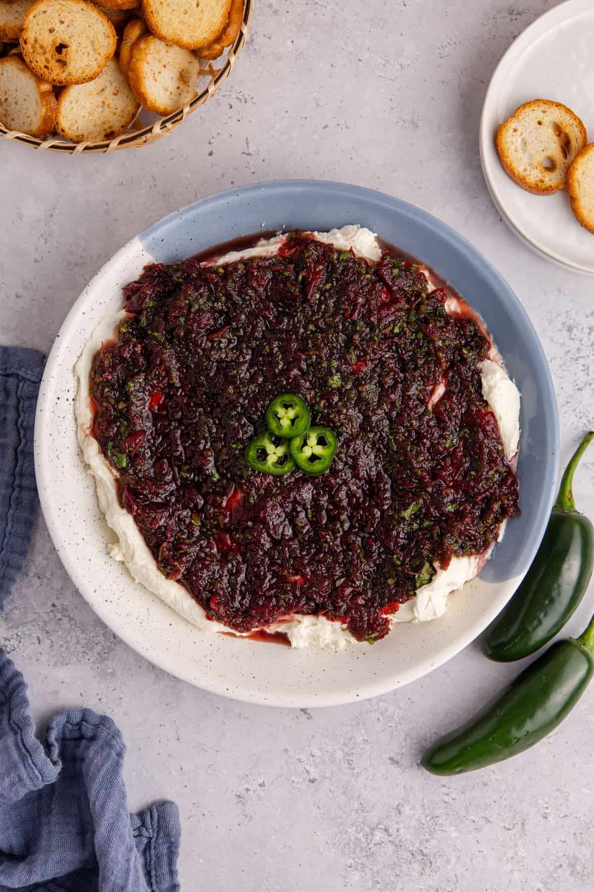 Cranberry Jalapeño Dip in a serving bowl with jalapeño slices as garnish from above