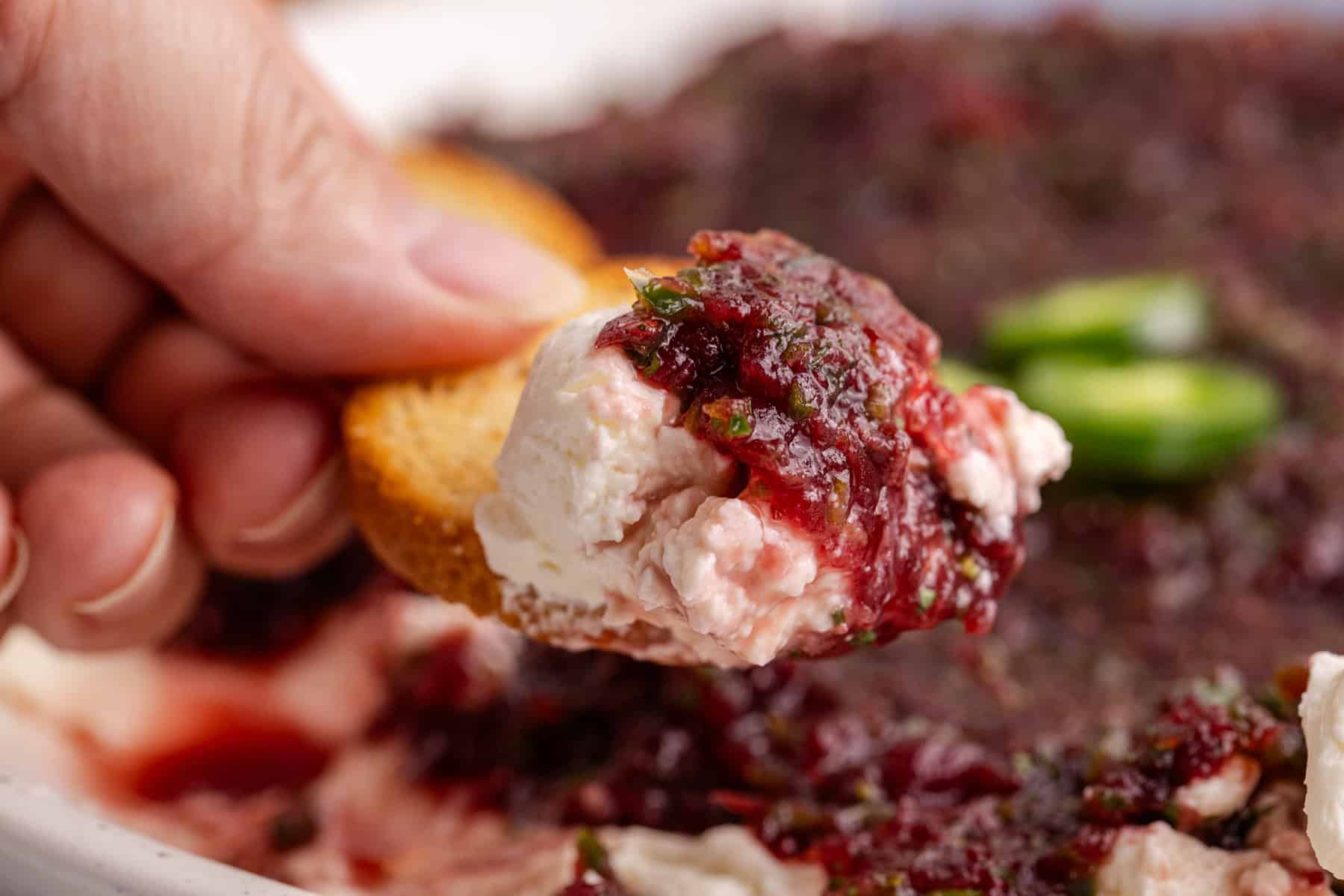 Cranberry Jalapeño Dip close up on a cracker