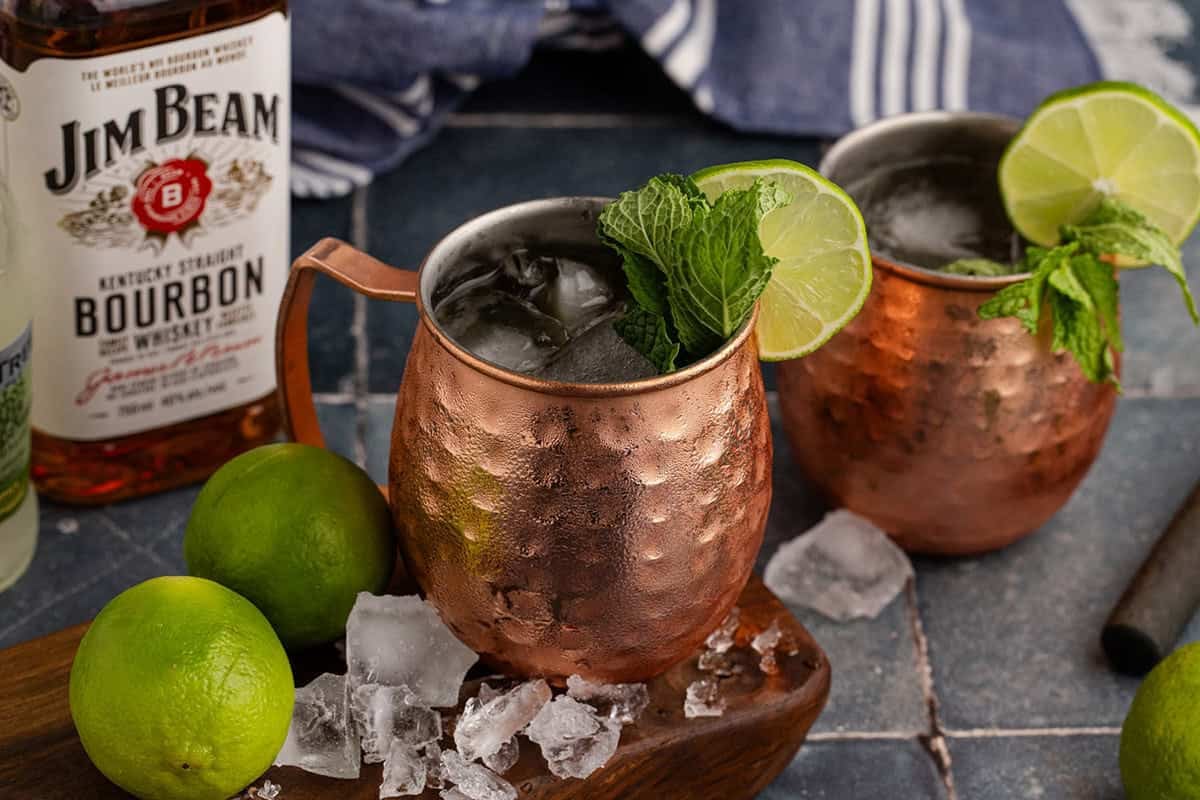 Kentucky Mule Cocktail on a serving board with ice all around